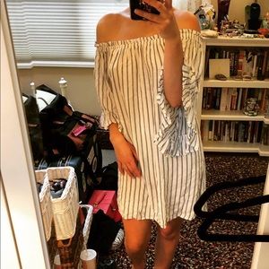 Light seaside summer dress with exposed shoulder.